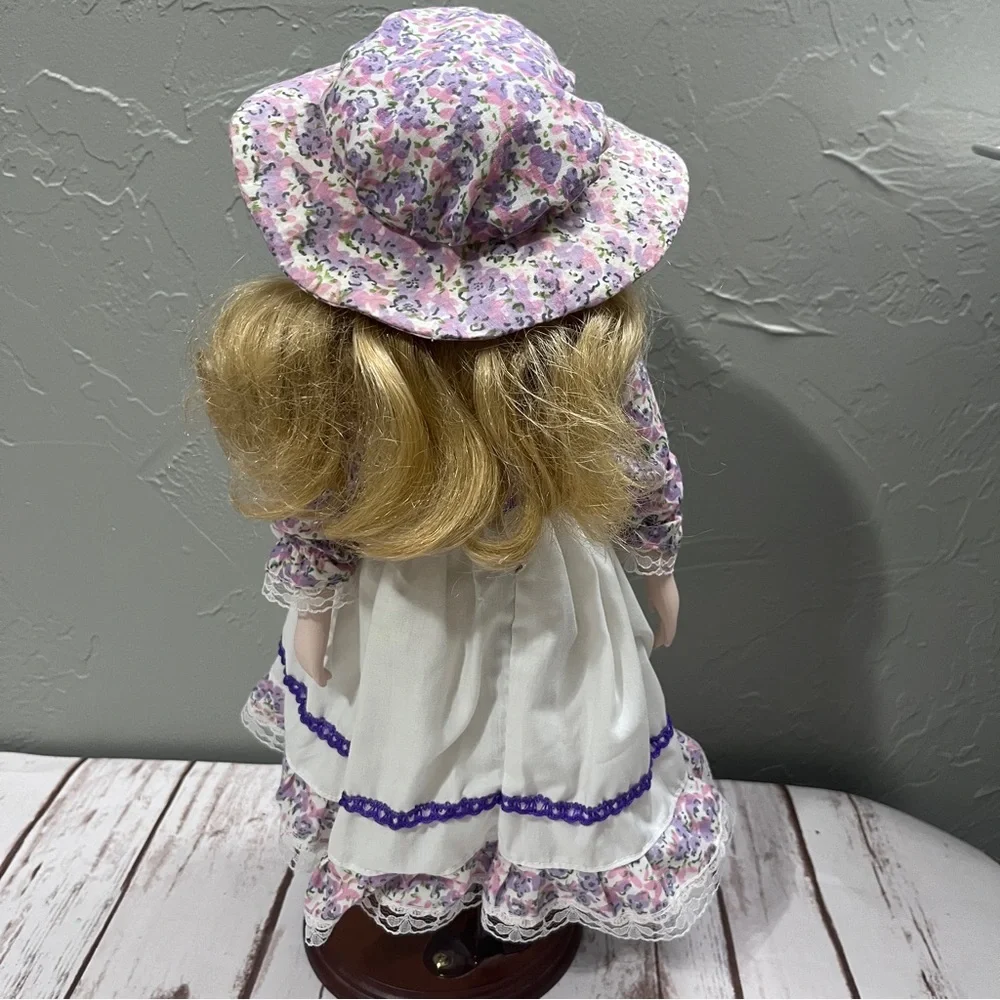 Porcelain Doll with purple floral dress and‎ Hat vintage